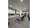 Gourmet kitchen featuring a large island with seating and high-end stainless steel appliances at 11318 San Arezzo Pl, Las Vegas, NV 89141