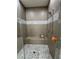 Walk-in shower featuring a built-in bench and mosaic tile accents at 11318 San Arezzo Pl, Las Vegas, NV 89141