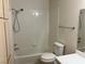 Standard bathroom featuring a shower-tub combo and modern fixtures at 1150 N Buffalo Dr # 2093, Las Vegas, NV 89128