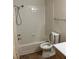 Bathroom with a tub and white tile surround at 1150 N Buffalo Dr # 2093, Las Vegas, NV 89128