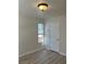 Bright bedroom with neutral walls, wood-look floors, and a sunny window at 1150 N Buffalo Dr # 2093, Las Vegas, NV 89128
