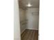 Walk-in closet with metal shelving for organization and storage space at 1150 N Buffalo Dr # 2093, Las Vegas, NV 89128