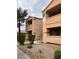 Multi-story condo building with private balconies and manicured landscaping at 1150 N Buffalo Dr # 2093, Las Vegas, NV 89128