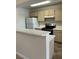 Cozy kitchen featuring white countertops and standard appliances at 1150 N Buffalo Dr # 2093, Las Vegas, NV 89128