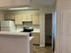 Well-lit kitchen with appliances, a breakfast bar, and plenty of counter space at 1150 N Buffalo Dr # 2093, Las Vegas, NV 89128