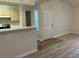 Bright kitchenette with breakfast bar pass through to living area and ample storage at 1150 N Buffalo Dr # 2093, Las Vegas, NV 89128