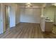 Spacious living room with hard surface floors adjacent to kitchen and hallway at 1150 N Buffalo Dr # 2093, Las Vegas, NV 89128