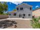 View of the backyard showing the patio, rock landscaping and mature trees at 11698 Firesteed Pl, Las Vegas, NV 89141