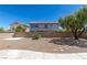 Backyard featuring a rock area surrounded by a sturdy brick wall, and some trees at 11698 Firesteed Pl, Las Vegas, NV 89141