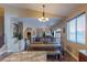 Open dining area with a farmhouse-style table and seamless access to the living spaces and kitchen at 11698 Firesteed Pl, Las Vegas, NV 89141