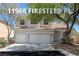 Charming two-story home with a tile roof, three-car garage, and mature landscaping in a well maintained yard at 11698 Firesteed Pl, Las Vegas, NV 89141