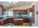 Well-appointed kitchen featuring stainless steel appliances, a center island, and plenty of natural light at 11698 Firesteed Pl, Las Vegas, NV 89141