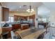 Spacious eat-in kitchen with stainless steel appliances, custom cabinets, tile floors, and plenty of light at 11698 Firesteed Pl, Las Vegas, NV 89141