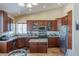 Modern kitchen with stainless steel appliances, granite countertops, custom cabinets and center island at 11698 Firesteed Pl, Las Vegas, NV 89141