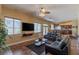 Spacious living area featuring comfortable seating, a modern entertainment setup, and ample natural light at 11698 Firesteed Pl, Las Vegas, NV 89141