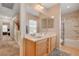 Bright bathroom with double sinks, a large mirror, and a tub-shower combo at 11919 Jersey Lilly St, Las Vegas, NV 89183