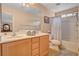 Bathroom featuring double sinks, tile floors, a bathtub, and a shower with neutral finishes at 11919 Jersey Lilly St, Las Vegas, NV 89183