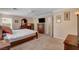 Bedroom features neutral tones, two windows, ceiling fan, and a matching furniture set at 11919 Jersey Lilly St, Las Vegas, NV 89183
