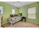 Cozy bedroom with bright green walls and a daybed by a window at 11919 Jersey Lilly St, Las Vegas, NV 89183