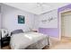 Cozy bedroom featuring ambient string lights and a double door closet at 11919 Jersey Lilly St, Las Vegas, NV 89183