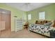 Comfortable bedroom with neutral carpet and a white desk and vanity at 11919 Jersey Lilly St, Las Vegas, NV 89183