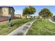 Neighborhood park with lush lawns, mature trees, and pet waste station, perfect for outdoor activities at 11919 Jersey Lilly St, Las Vegas, NV 89183