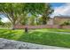 Well-maintained community park with mature trees, green grass, and walking paths for residents at 11919 Jersey Lilly St, Las Vegas, NV 89183