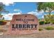 Welcoming community sign reading 'Welcome to Liberty at Tierra Linda' with beautiful landscaping at 11919 Jersey Lilly St, Las Vegas, NV 89183