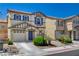 Attractive home with blue shutters, a landscaped front yard, and a spacious two-car garage at 11919 Jersey Lilly St, Las Vegas, NV 89183