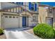 Close up of this beautiful home exterior with a two-car garage and manicured yard at 11919 Jersey Lilly St, Las Vegas, NV 89183