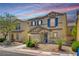 Inviting home exterior with blue shutters, a lush lawn, and a convenient two-car garage at 11919 Jersey Lilly St, Las Vegas, NV 89183