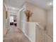 Upstairs hallway with carpet and floral decoration, leading to bedrooms and featuring a closet at 11919 Jersey Lilly St, Las Vegas, NV 89183