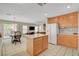 Open kitchen with island and dining area flowing into the living room at 11919 Jersey Lilly St, Las Vegas, NV 89183