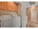 Functional laundry area equipped with appliances and closet storage at 11919 Jersey Lilly St, Las Vegas, NV 89183