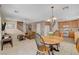 Open layout connects the living room, dining area, and kitchen, perfect for entertaining at 11919 Jersey Lilly St, Las Vegas, NV 89183