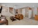 Inviting living room featuring tile flooring and a seamless flow to kitchen and staircase at 11919 Jersey Lilly St, Las Vegas, NV 89183