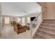 Cozy living space featuring a staircase, dining area, and comfortable seating at 11919 Jersey Lilly St, Las Vegas, NV 89183