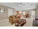 Open concept living room featuring tile flooring and easy access to kitchen and dining areas at 11919 Jersey Lilly St, Las Vegas, NV 89183