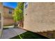 Charming patio area with artificial grass, ideal for outdoor dining and entertaining at 11919 Jersey Lilly St, Las Vegas, NV 89183