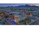 A stunning aerial view showcasing the property's pool, landscaping, and mountain views at 12341 Ferry Glide Ave, Las Vegas, NV 89138
