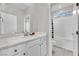 Bright bathroom with white cabinets, tub and shower combo, and natural light at 12341 Ferry Glide Ave, Las Vegas, NV 89138