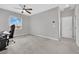 Generously sized bedroom with neutral carpeting, fan, and a large window providing ample natural light at 12341 Ferry Glide Ave, Las Vegas, NV 89138