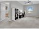 Comfortable, carpeted bedroom featuring a ceiling fan and bright window to create a serene space at 12341 Ferry Glide Ave, Las Vegas, NV 89138