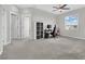 Spacious bedroom featuring a ceiling fan, bright window and plush carpeting for comfort at 12341 Ferry Glide Ave, Las Vegas, NV 89138