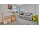 Bedroom offering crib, couch, and natural light at 12341 Ferry Glide Ave, Las Vegas, NV 89138