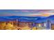 A scenic cityscape view from this home, revealing city lights against a mountain backdrop at 12341 Ferry Glide Ave, Las Vegas, NV 89138