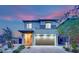Charming home front view with a brick driveway, tidy landscaping, and an inviting entrance at twilight at 12341 Ferry Glide Ave, Las Vegas, NV 89138
