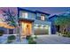 Charming two-story home with a spacious driveway and a two-car garage at 12341 Ferry Glide Ave, Las Vegas, NV 89138