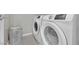 Bright laundry room with modern, front-loading washer and dryer for convenient home care at 12341 Ferry Glide Ave, Las Vegas, NV 89138