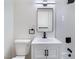 Bright bathroom featuring white vanity, toilet, modern sink, and minimalist design at 1401 E Clark Ave, Las Vegas, NV 89101